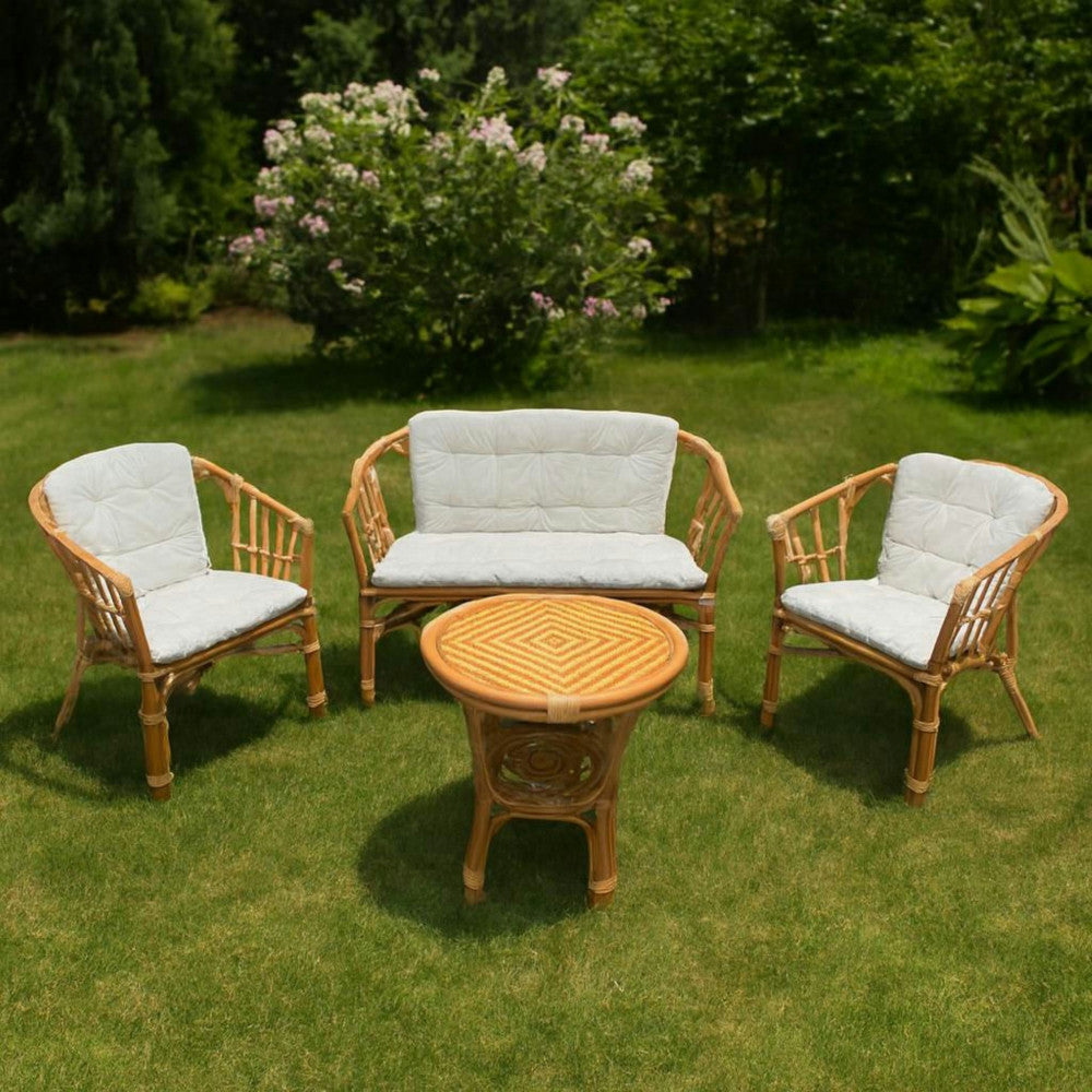 Salotto da esterno 4 posti con cuscini imbottiti e struttura in legno wicker con tavolino